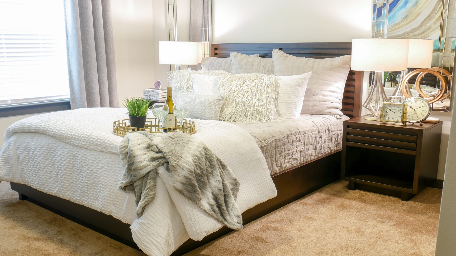a bedroom with a bed, nightstands and a lamp at The Terra at University North Park