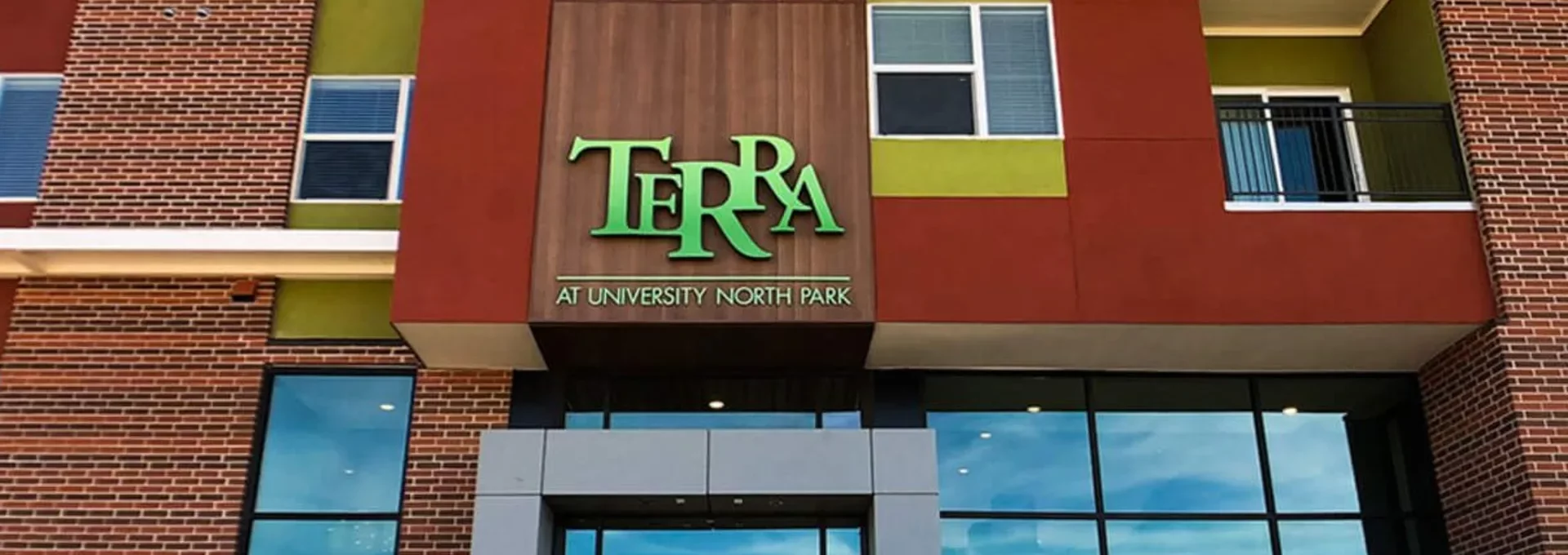 the front of a building with the word terra on it at The Terra at University North Park