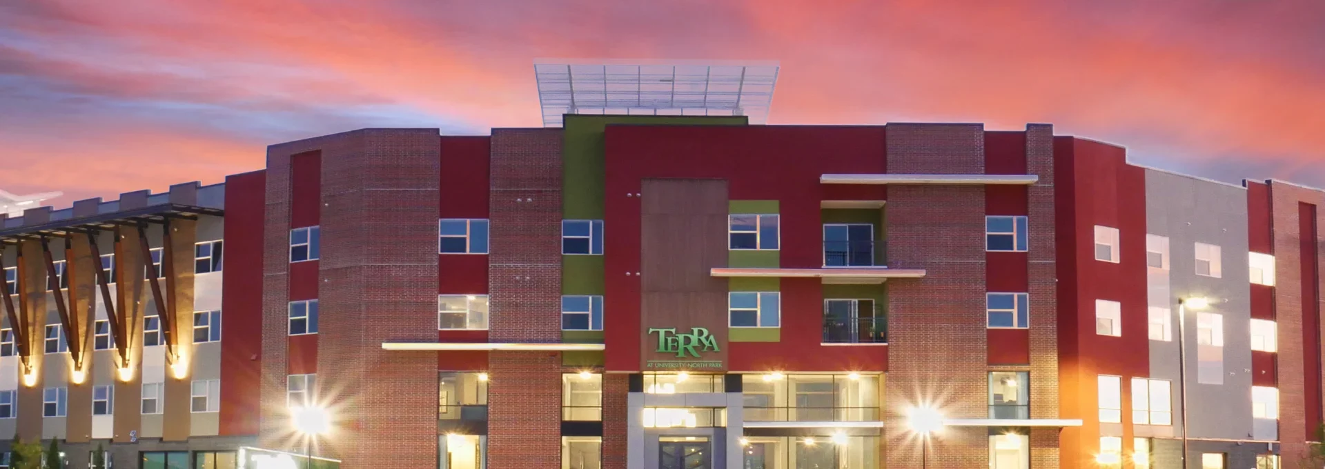 the exterior of a modern apartment building at The Terra at University North Park