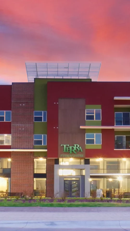 the exterior of a modern apartment building at The Terra at University North Park