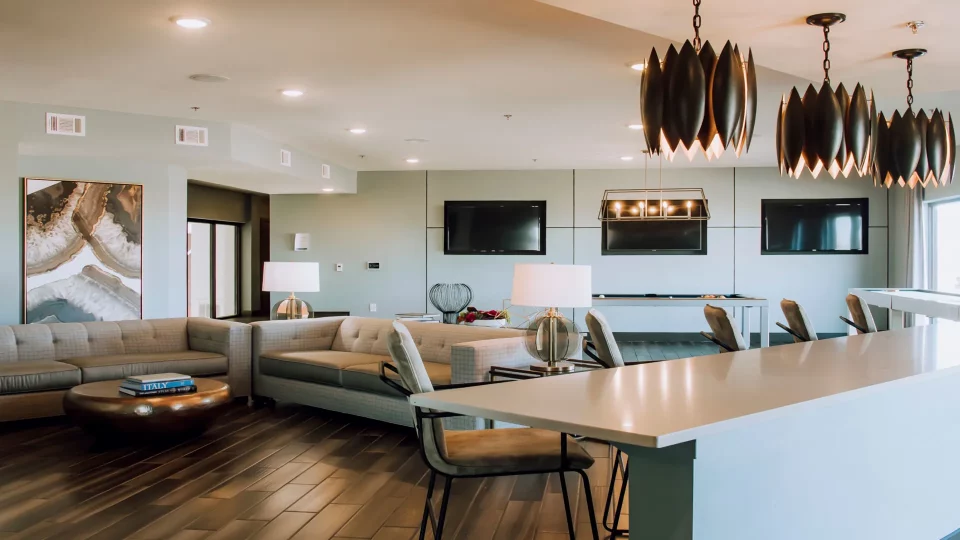 a modern living room with a large kitchen and dining area at The Terra at University North Park