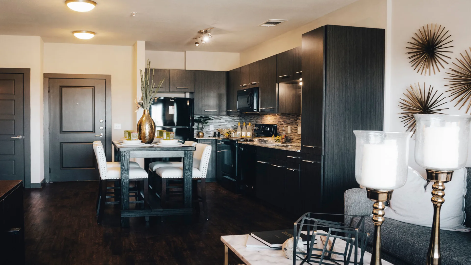 a kitchen and living room with a dining table at The Terra at University North Park