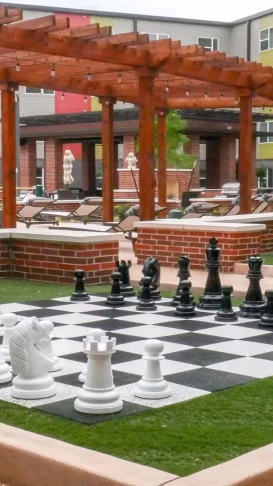 a chess board in front of a courtyard with a patio at The Terra at University North Park